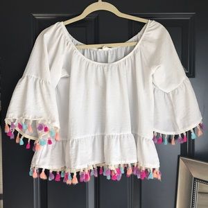 White Off the Shoulder top with rainbow tassels